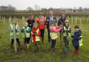 (middle left) Cllr Linda Robinson, who represents Upton Snodsbury on Wychavon District Council and (middle right) Cllr Robert Raphael, council chairman, help staff and pupils from Upton Snodsbury C of E First School plant the new woodland