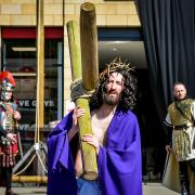 Jesus carries a cross during the Worcester Passion Play. Pictures by Purple Swan Community Photography.