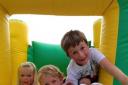 FUN: Jean Alexander, Elgan Purser, George Alexander and Finn Williams enjoy the bouncy castle at the Ebrington Village Fete, which raised £5,000.