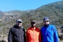 STEEP CHALLENGE: From left - Steve Dennis, Private Expeditions guide Ronald Mamuya and Alan Guthrie heading up Kilimanjaro.