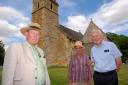SAVED: Church wardens Hamish Cathie and Caroline Henderson and treasurer David Brown outside St Lawrence Church in Barton-on-the-Heath, which has been awarded lottery cash for its collapsing roof. Picture by Paul Jackson. 3114664001