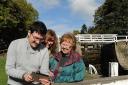 launch: Graphic designer Tom Blockley shows the app to Judy Green and Jean Jones at Bingley Five Rise Locks