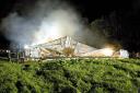 The barn collapses at the height of the blaze