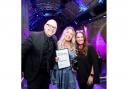 Katie Hemming (centre) celebrates winning the award for 'Enviable Volume' at the GLammies