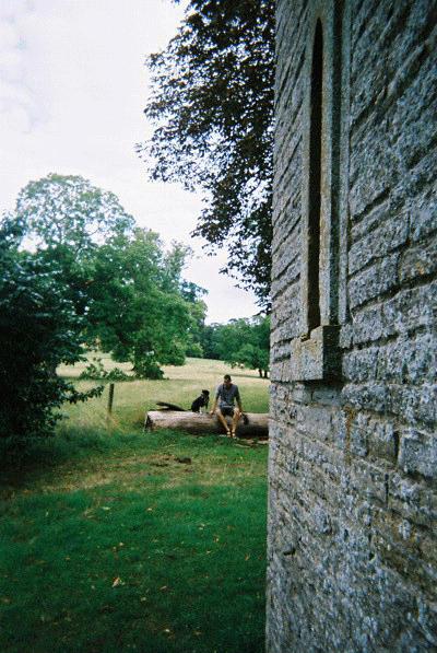 Mark & Jemima sitting on a tree stump by Leicester Tower