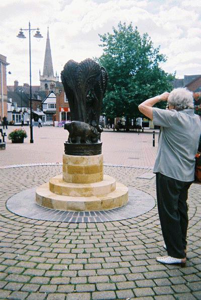 Maggie taking a photo of Eof's statue in Market Square