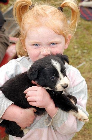 Rosey Biddle, 3, with Wisp the puppy