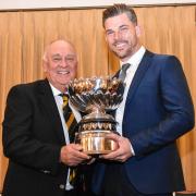 Richard Preen (right) receives the Lloyd Cup from club captain Andy Basford. Picture: BROADWAY GOLF CLUB