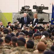 Prime Minister Boris Johnson with Prime Minister of Estonia Kaja Kallas meeting NATO troops after a joint press conference at the Tapa Army Base in Tallinn, Estonia. Picture date: Tuesday March 1, 2022. PA Photo. See PA story POLITICS Ukraine. Photo