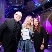 Katie Hemming (centre) celebrates winning the award for 'Enviable Volume' at the GLammies