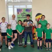 Worcester Warriors stars Paige Farries (white t-shirt) and Caity Mattinson (back row green t-shirt) dropped in to the Mini Scrummers Rugby launch at Pershore High School