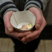 A beggar in Pershore has been handed a warning by police.