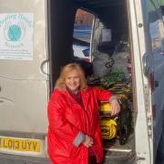 Sue Stretton, founder of the Healing Hands Network, helps load the generators before they head off to Ukraine