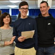 Daniel Logue from The Cotswold School and his parents are overjoyed with the results.