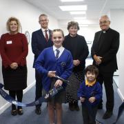 Arthur Ewart and Maddie Emms officially open the building along with executives at the school and religious dignitaries.