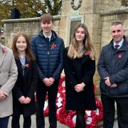 Students at Prince Henry's High School at Evesham's War Memorial.