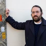 MISSION: Richard Huish has taken down hundreds of stickers as he raises the issue of fly-posting in Evesham