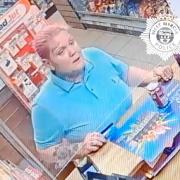 POLICE: Officers want to speak to this woman after a purse was stolen from a car