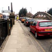 JAM TODAY: Queueing traffic on Abbey Bridge. The planned complete closure of the bridge may be delayed. Picture by John Bryan.