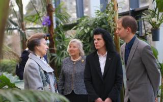 HRH The Princess Royal speaks to Josh Egan-Wyer, Head of Horticulture at Pershore College and Angela Joyce, CEO of WCG, inside the Collections House at Pershore College