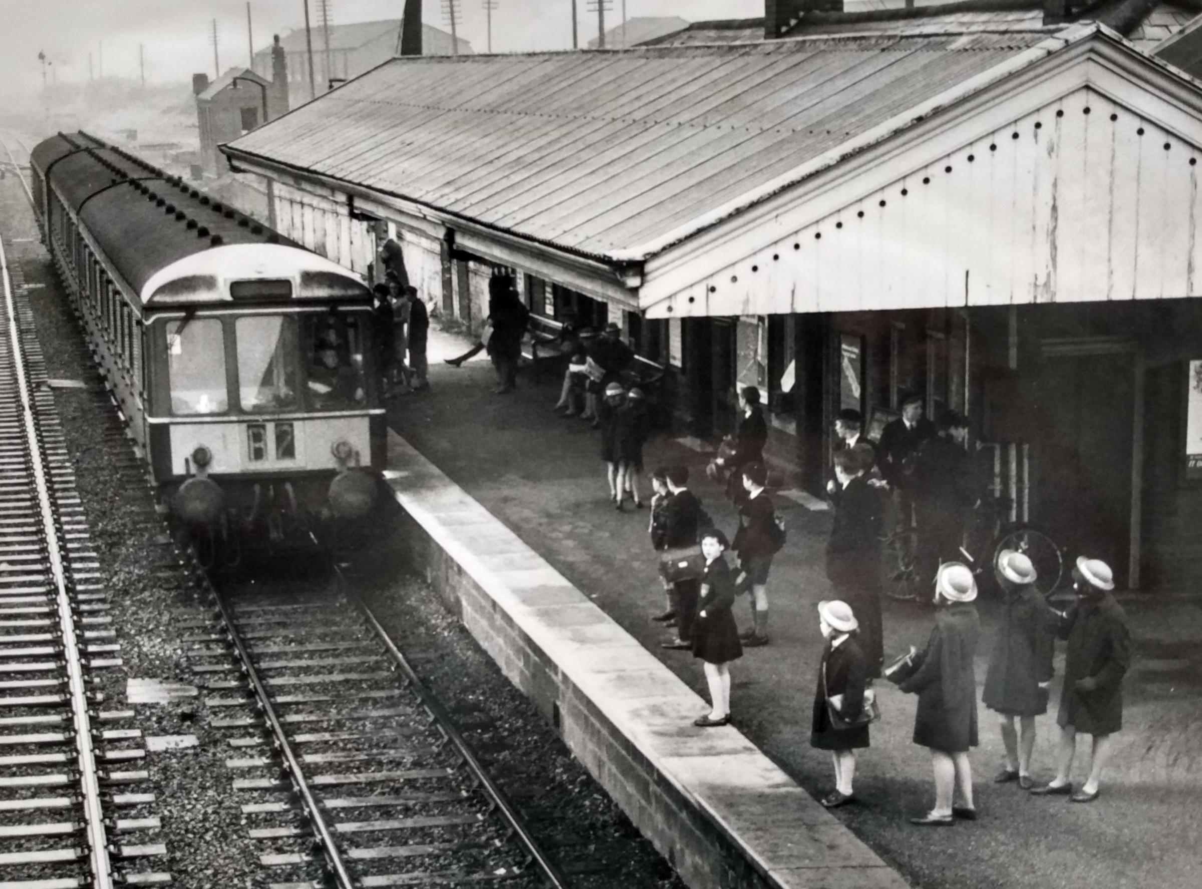 This charming picture of schoolchildren ready to board the arriving train at Pershore station was taken in December 1967