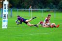 Evesham's Will Bugg dives in for his first try. Picture: ROLAND BAILEY