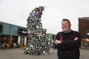 Paul James, Regional Centre Manager, at The Valley, Evesham with the quirky Christmas tree.