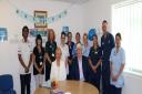 Derek Bedford and his wife Cathy with staff at Evesham Community Hospital