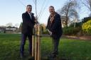 Nigel Huddleston MP (left) for Mid-Worcestershire and Cllr Robert Raphael (right), chairman of Wychavon District Council, plant one of the cherry trees in Abbey Park