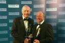 AWARD: Shane Howells (right) receives the award from snooker legend Steve Davis. Picture supplied by Shane Howells Ltd.