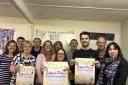 Salford Priors fete commitee pose with event posters.