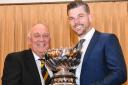 Richard Preen (right) receives the Lloyd Cup from club captain Andy Basford. Picture: BROADWAY GOLF CLUB