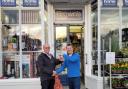 Nick Green hands over the keys to the shop to Brian Marshall