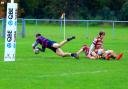 Evesham's Will Bugg dives in for his first try. Picture: ROLAND BAILEY