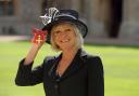 TV presenter Sue Barker after receiving her Officer of the Order of the British Empire (OBE) medal at an Investiture ceremony in Windsor Castle, Berkshire.