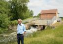 Charles Hudson in front of the Pershore hydroelectric plant which is featured in Good Energy’s national campaign