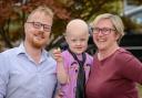 Four-year-old Drew Howard-Carter with mum and dad, Su and Jason