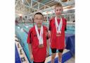 Winners: Milton Xavier Yau (left) and Daniel Kryzwicki (right) with their medals on display from the Worcestershire County Championships.