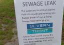 A sign has been placed at the site of a 'bog' in Aldington caused by overflowing sewage