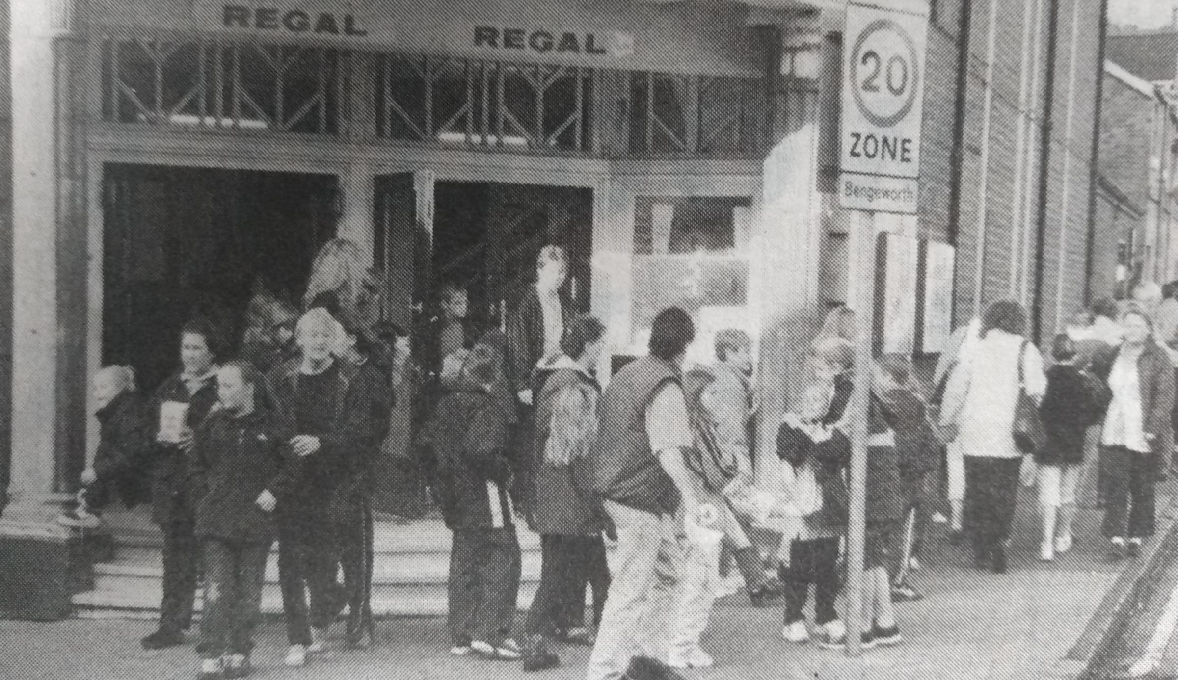 Cinemagoers pour out of the Regal after a film in the late 90s 