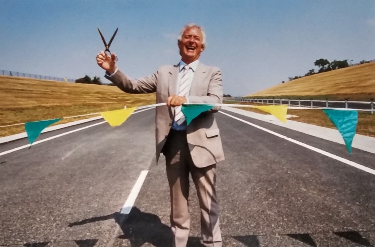 MP Michael Spicer cuts the ribbon to officially open the latest stage of the A46 trunk road in August 1995