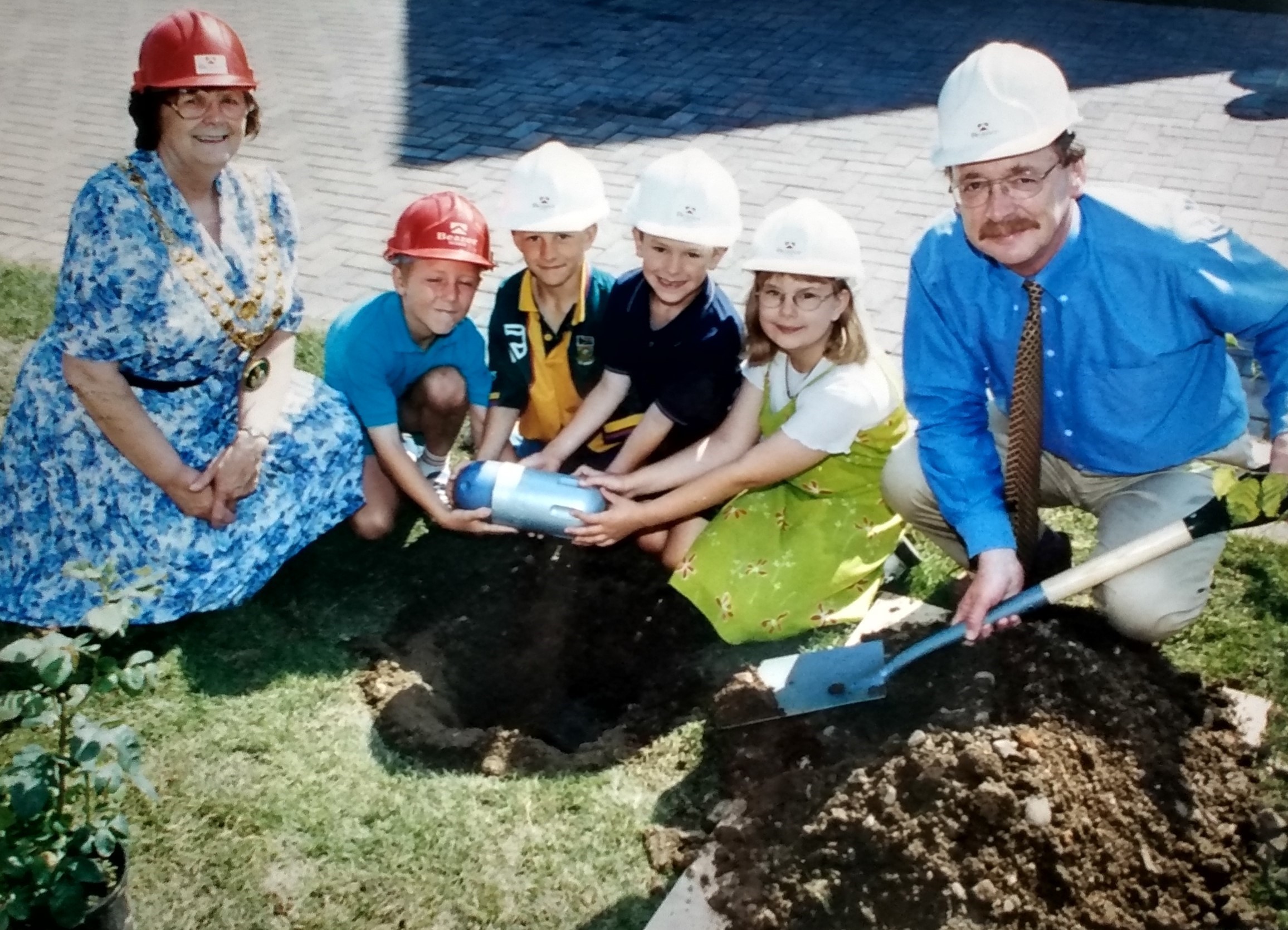 It’s July 1999 and some of the prizewinners from Abbey Park First School in Pershore prepare to bury a millennium time capsule at the new Priory Gardens housing development in the town, watched by mayor Cllr Marion Freeman