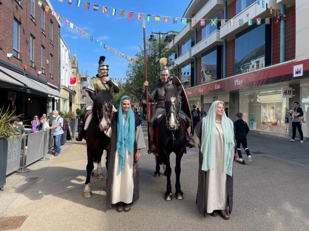 Evesham Journal: Actors dressed as Roman soldiers arrived on horseback