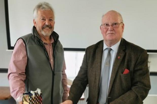In-coming chair Brian Barber (left) presented Bill Arnold with an engraved crystal whisky decanter on behalf of the board