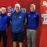 National swimming competitors Hannah Woodcock and Patrick Heeks with Pershore coach Tom Naughton. Picture: PERSHORE SWIMMING CLUB