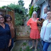 ANGRY: Common Road residents, including Joanne Kitchen (centre right)