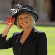 TV presenter Sue Barker after receiving her Officer of the Order of the British Empire (OBE) medal at an Investiture ceremony in Windsor Castle, Berkshire.