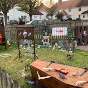The Merriman's front garden has been transformed into a graveyard to celebrate upcoming birthdays