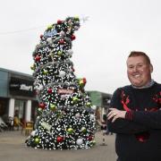 Paul James, Regional Centre Manager, at The Valley, Evesham with the quirky Christmas tree.