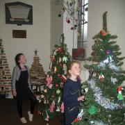 Lilia and Phoebe Underwood enjoyed exploring the 40-plus Christmas trees on display at Eckington Parish Church.  Each one had a different theme, created by village businesses and voluntary groups